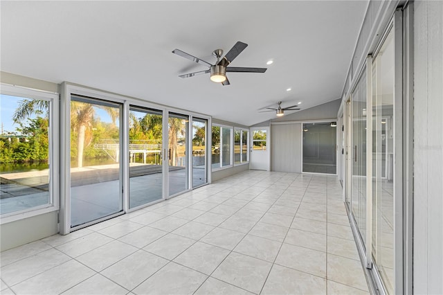 unfurnished sunroom featuring ceiling fan and lofted ceiling