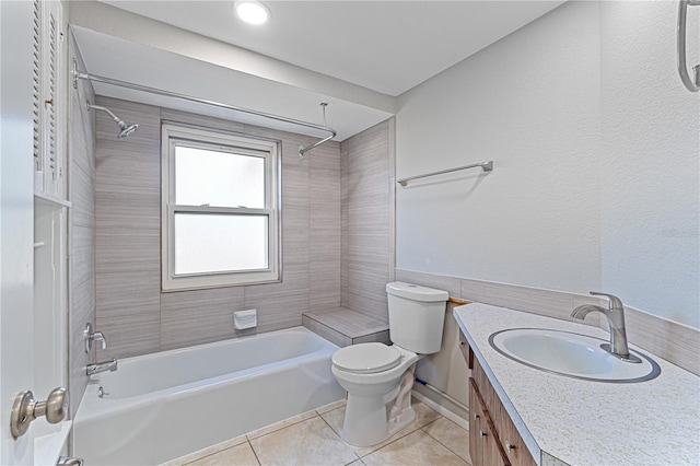 full bathroom with tile patterned floors, vanity, toilet, and tiled shower / bath