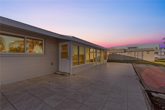 view of patio terrace at dusk