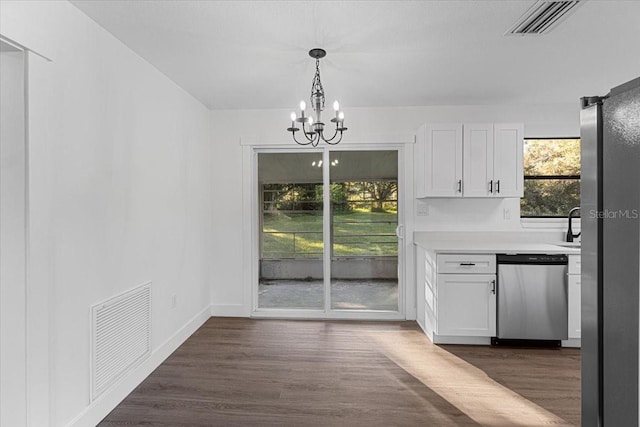 interior space with dark hardwood / wood-style flooring and an inviting chandelier