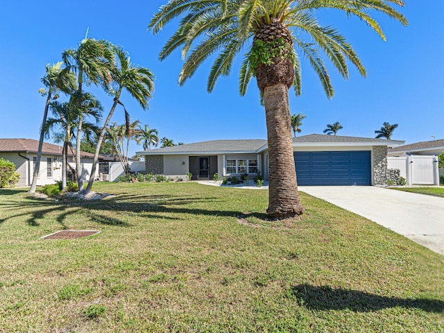 single story home with a garage and a front yard