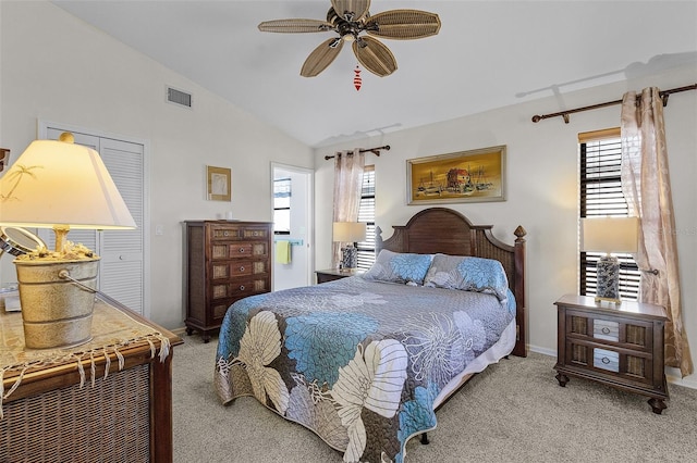 bedroom featuring ceiling fan, light colored carpet, and lofted ceiling