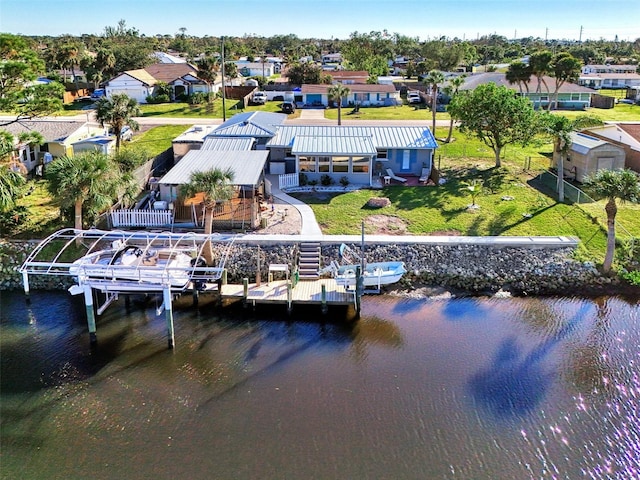 exterior space featuring a yard and a water view