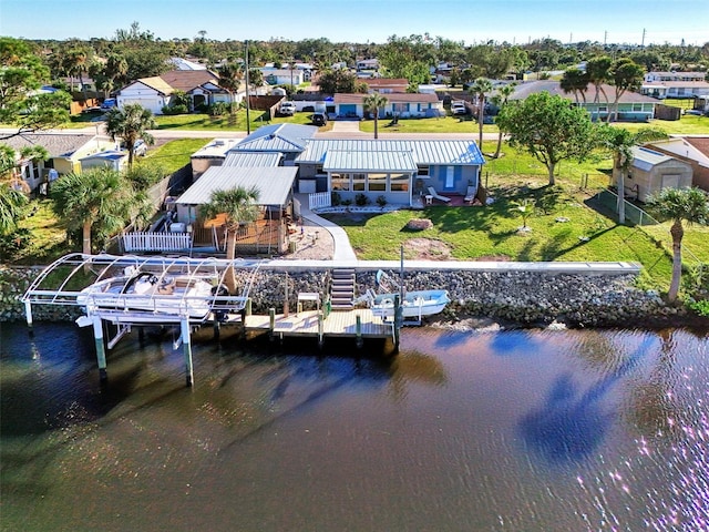 824 E 6th St, Englewood, FL 34223 - dock area featuring a water view, boat lift, a residential view, and a yard
