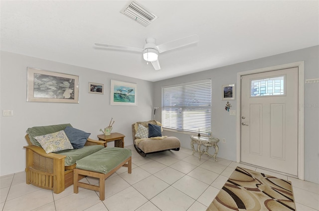 sitting room featuring light tile patterned floors and ceiling fan