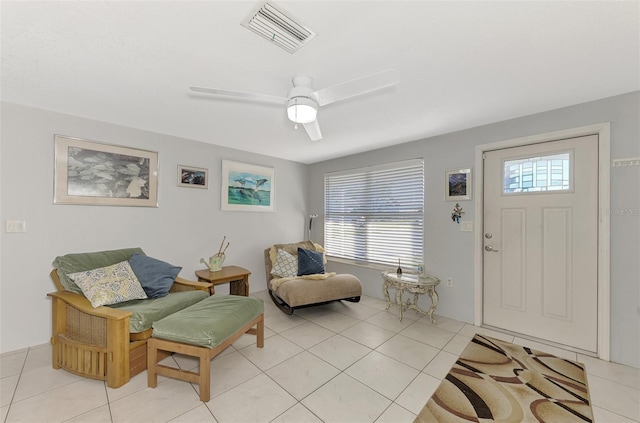 824 E 6th St, Englewood, FL 34223 - foyer with healthy amount of natural light, light tile patterned floors, and a ceiling fan