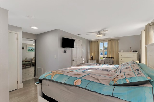 824 E 6th St, Englewood, FL 34223 - bedroom with light wood-style flooring, ceiling fan, and a closet
