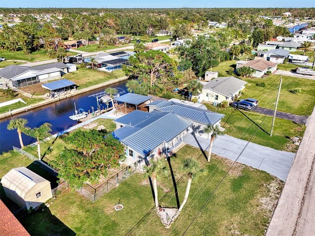 824 E 6th St, Englewood, FL 34223 - aerial perspective of suburban area featuring a large body of water