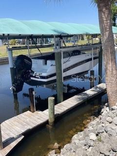 824 E 6th St, Englewood, FL 34223 - dock area featuring boat lift and a water view