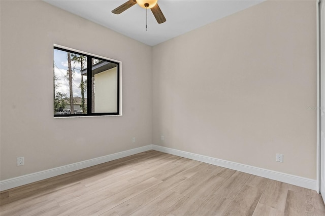 spare room with ceiling fan and light hardwood / wood-style floors