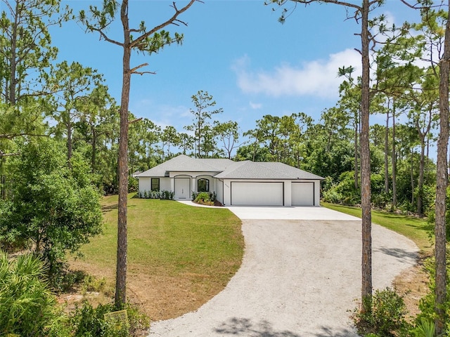 ranch-style home with a garage and a front lawn