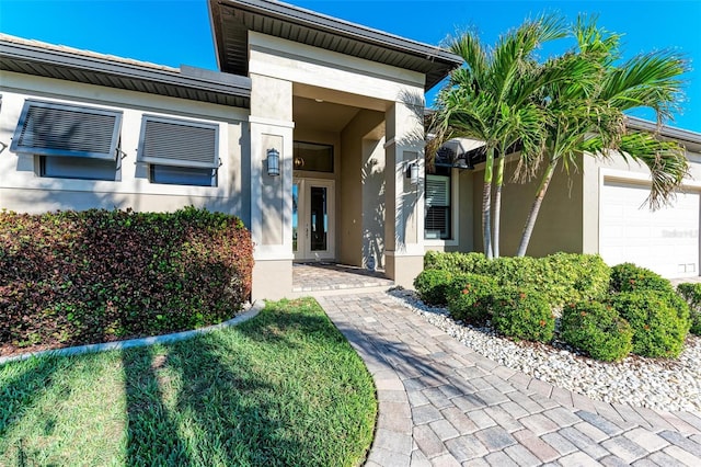 view of exterior entry featuring a garage