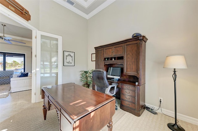 home office featuring a high ceiling, ceiling fan, and crown molding