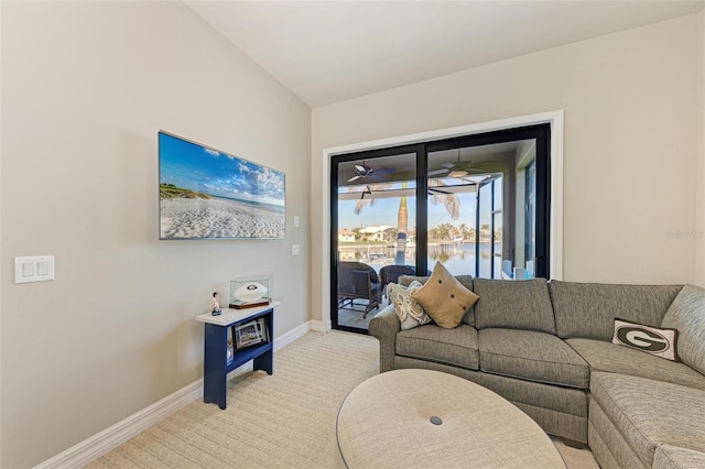 living room with light carpet and ceiling fan