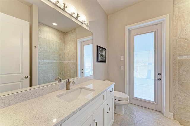 bathroom with vanity and toilet