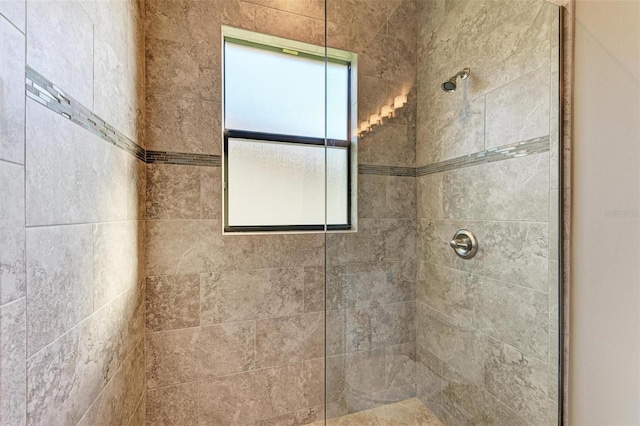 bathroom with tiled shower