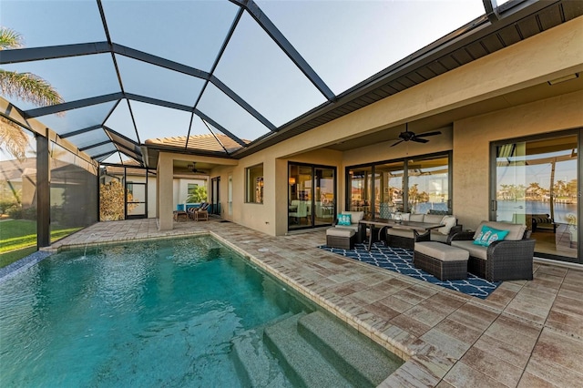 view of pool with ceiling fan, a lanai, an outdoor hangout area, and a patio