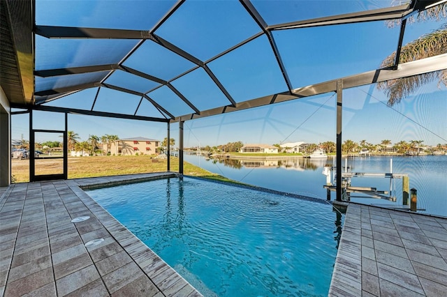 view of swimming pool featuring a boat dock and a water view