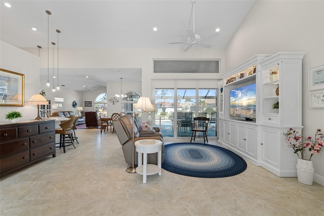 interior space with ceiling fan and high vaulted ceiling