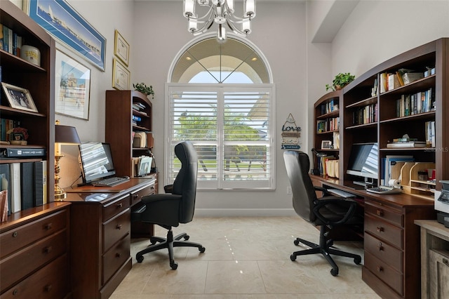 tiled office featuring a chandelier