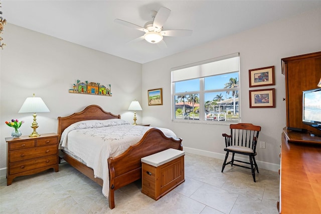 bedroom featuring ceiling fan and light tile patterned flooring