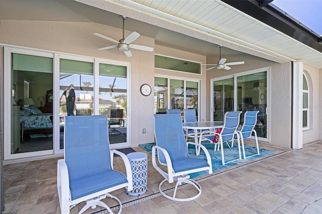 view of patio / terrace featuring ceiling fan