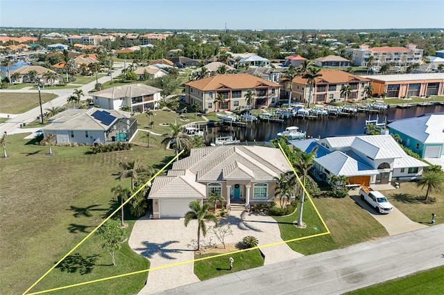 birds eye view of property with a water view