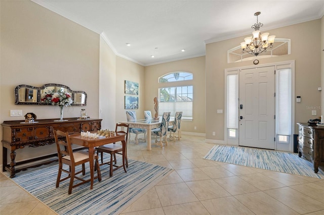 entrance foyer featuring crown molding, light tile patterned flooring, and an inviting chandelier