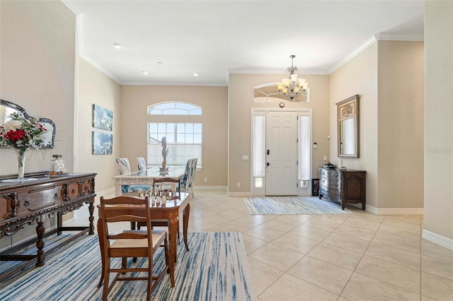 foyer entrance with ornamental molding, light tile patterned floors, and a chandelier