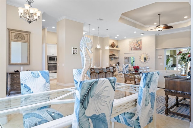 tiled living room with ceiling fan with notable chandelier and ornamental molding