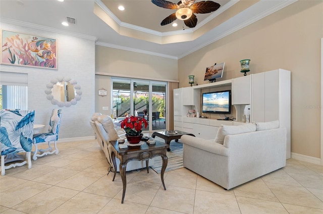 living room with light tile patterned floors, crown molding, ceiling fan, and a healthy amount of sunlight