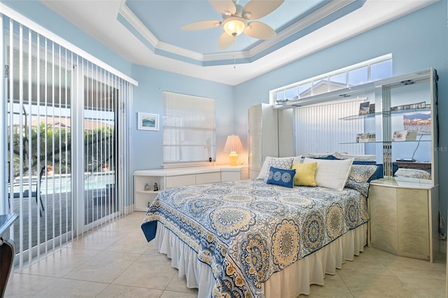 bedroom with access to outside, multiple windows, ceiling fan, and a raised ceiling