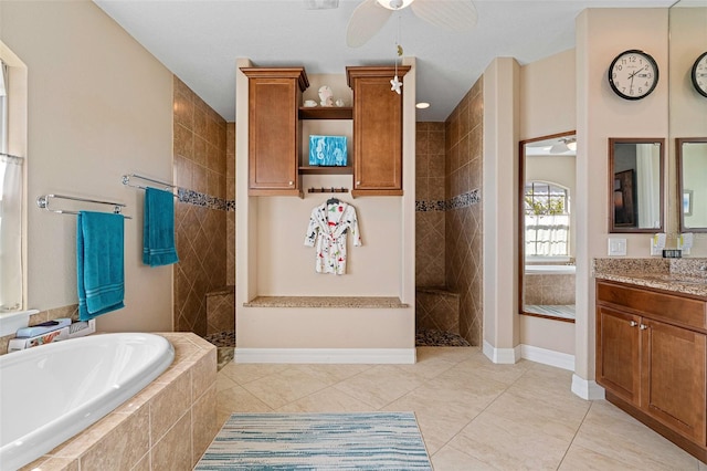 bathroom with tile patterned floors, vanity, ceiling fan, and shower with separate bathtub