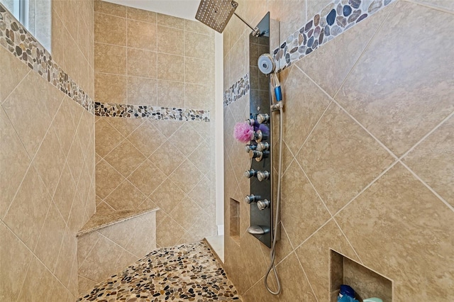 bathroom featuring a tile shower