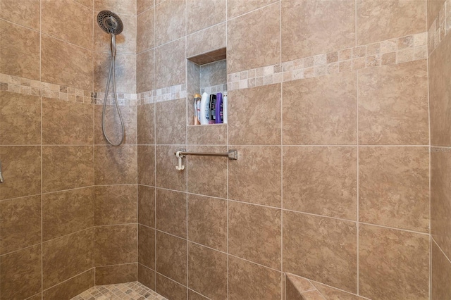 bathroom with tiled shower