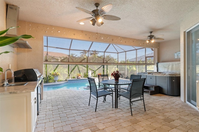 interior space featuring ceiling fan and sink