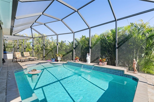 view of swimming pool featuring a patio, pool water feature, and a lanai