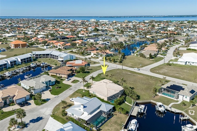 bird's eye view with a water view