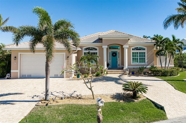 mediterranean / spanish-style home featuring a garage