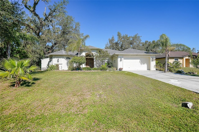 17080 Kellog Ave, Port Charlotte, FL 33954 - view of front of house with a garage, concrete driveway, a front lawn, and stucco siding