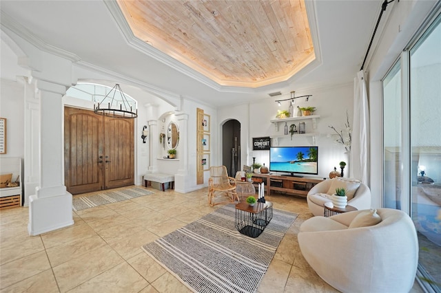 17080 Kellog Ave, Port Charlotte, FL 33954 - living area featuring ornate columns, a raised ceiling, wooden ceiling, crown molding, and a chandelier