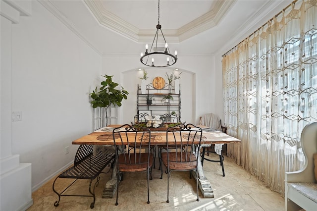 17080 Kellog Ave, Port Charlotte, FL 33954 - dining room featuring a chandelier, crown molding, and a tray ceiling
