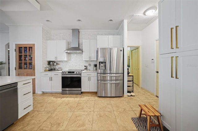 17080 Kellog Ave, Port Charlotte, FL 33954 - kitchen featuring stainless steel appliances, wall chimney range hood, light countertops, white cabinetry, and backsplash
