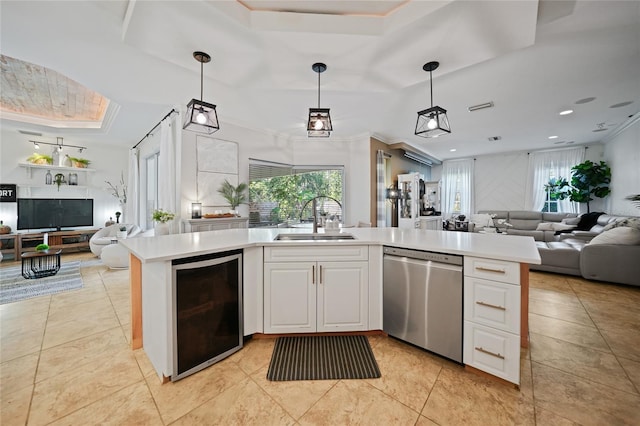 17080 Kellog Ave, Port Charlotte, FL 33954 - kitchen with open floor plan, dishwasher, a sink, a tray ceiling, and crown molding