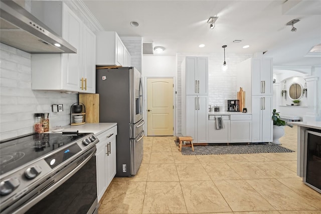 17080 Kellog Ave, Port Charlotte, FL 33954 - kitchen with wall chimney range hood, appliances with stainless steel finishes, light countertops, white cabinets, and recessed lighting