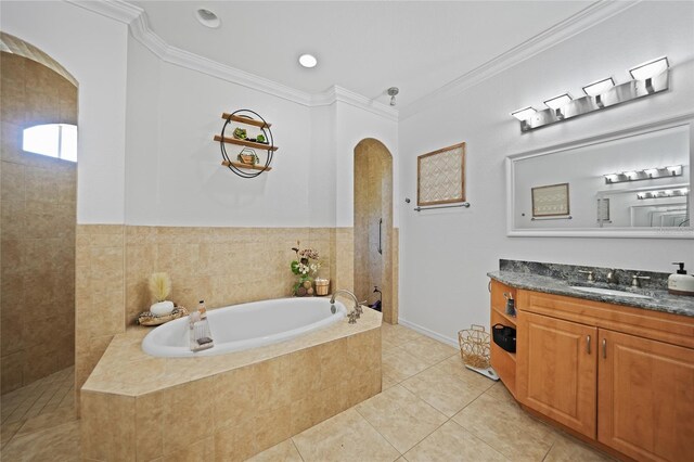 17080 Kellog Ave, Port Charlotte, FL 33954 - bathroom with a garden tub, vanity, tile patterned flooring, ornamental molding, and a walk in shower