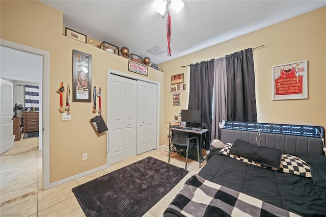 17080 Kellog Ave, Port Charlotte, FL 33954 - bedroom with light tile patterned floors, a closet, and baseboards