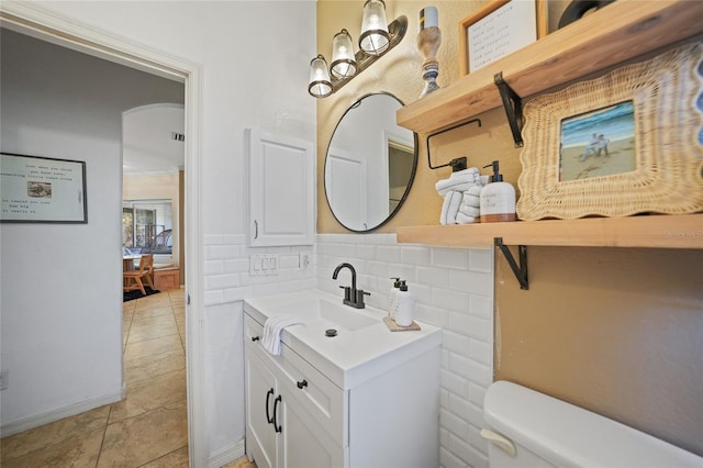 17080 Kellog Ave, Port Charlotte, FL 33954 - bathroom with vanity, toilet, and tile patterned floors