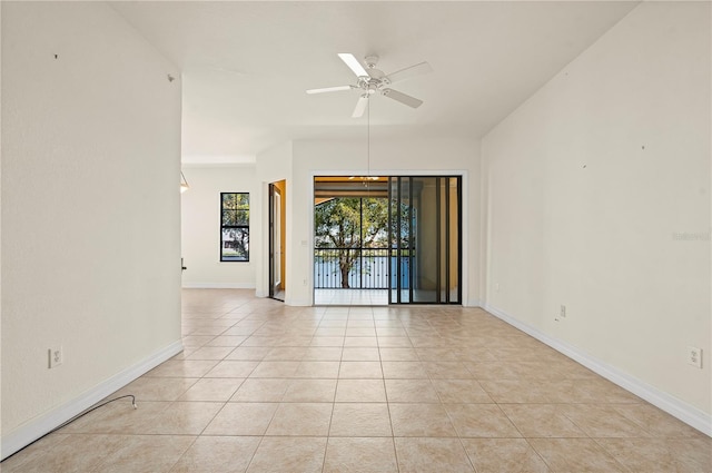 unfurnished room with ceiling fan and light tile patterned floors