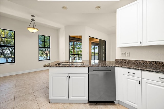 kitchen with white cabinets, dishwasher, sink, and dark stone counters